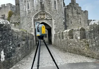 Total station surveying a castle